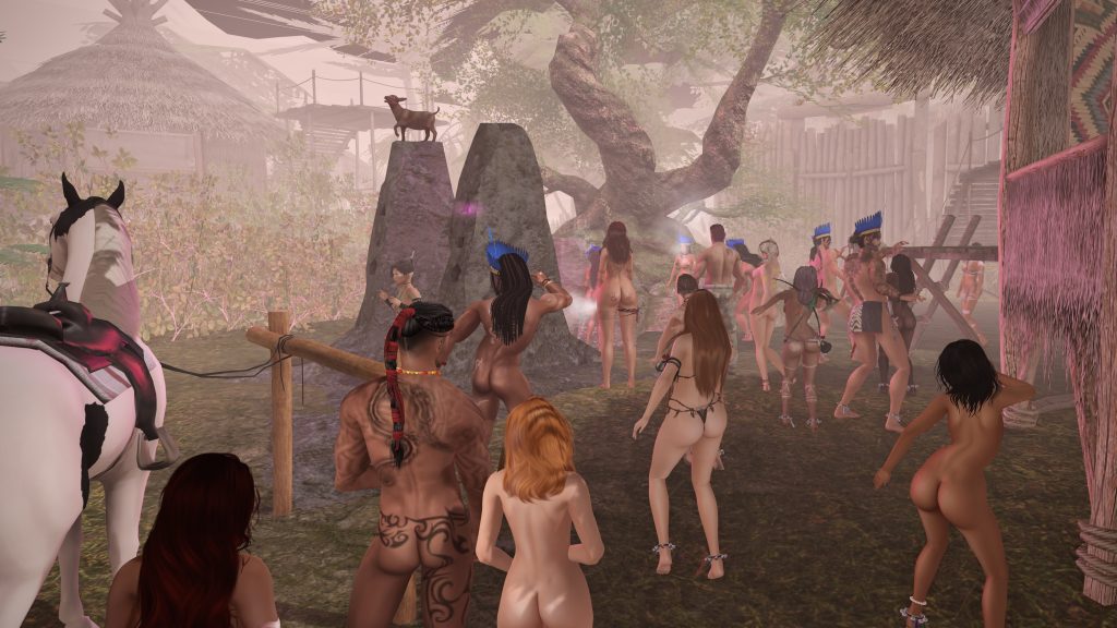 A gathering of bare men and women with tribal attire and headdresses dance under trees near stone pillars in a lively jungle setting