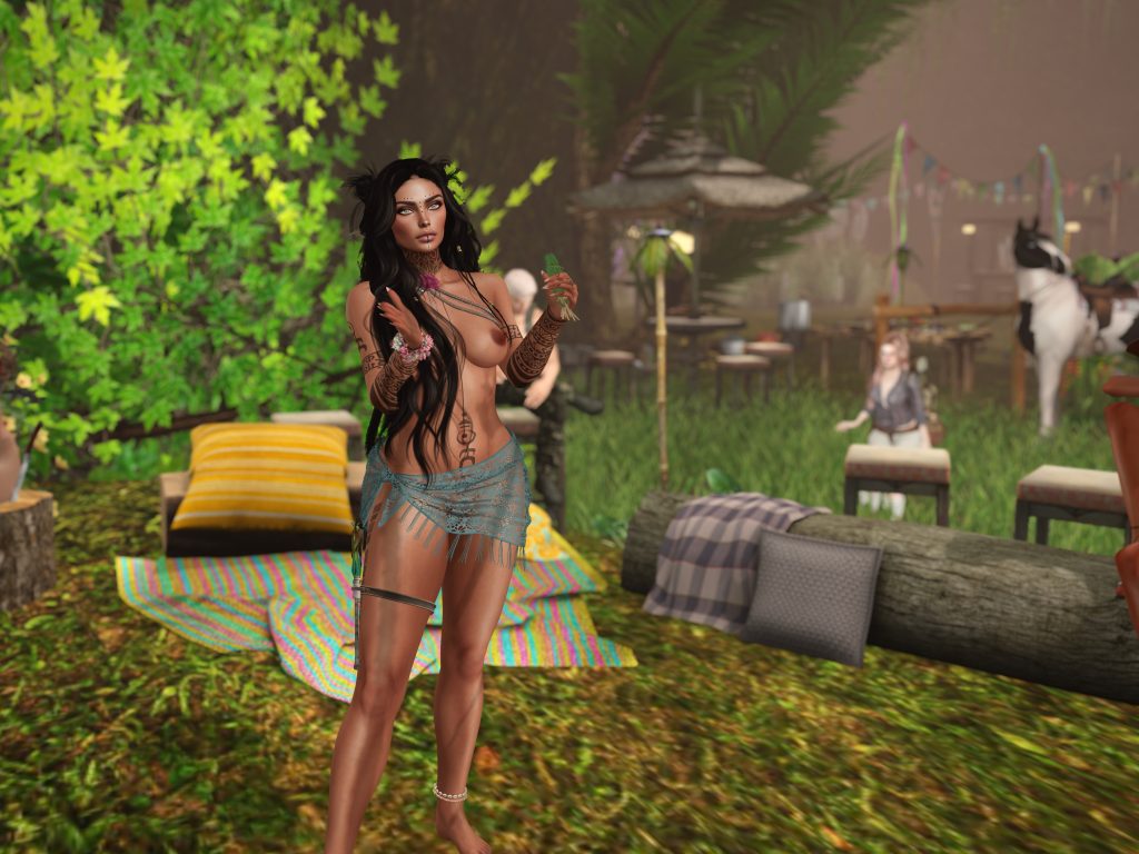 Topless native woman stands in jungle camp with arm beads and face markings