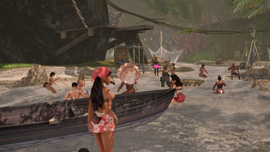 Group of people enjoying a tropical beach setting with boats and vibrant foliage.