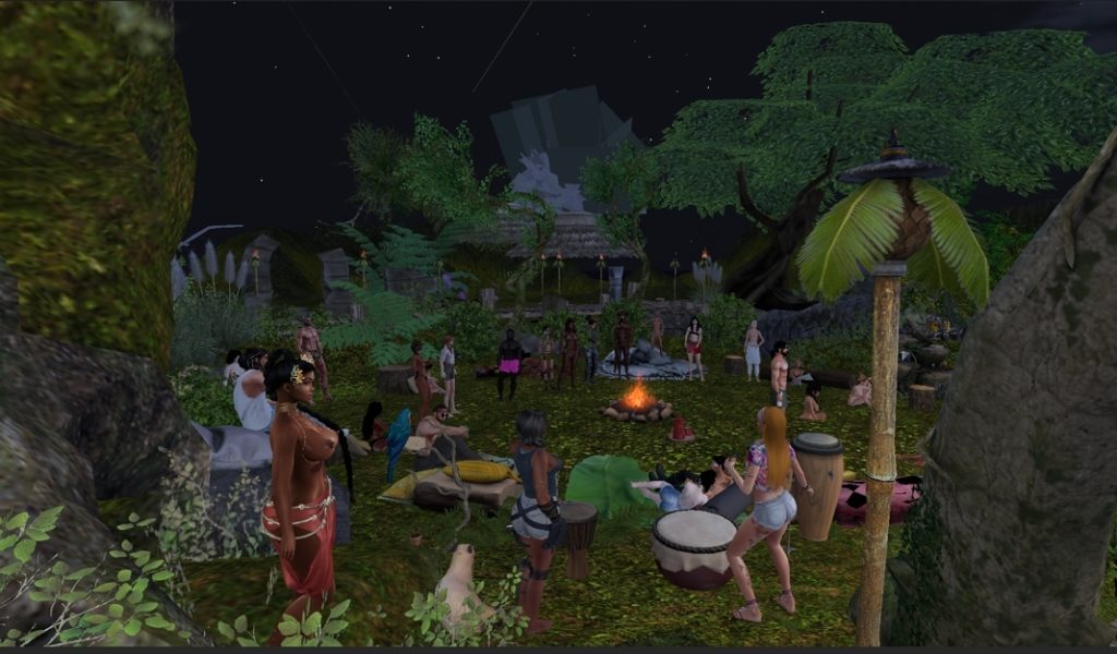 Tribal members gather around a campfire drumming in the jungle clearing at night