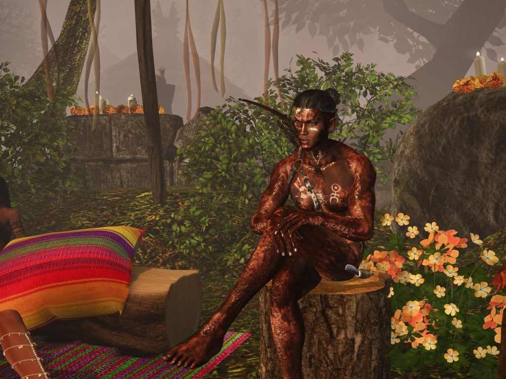 Shirtless villager sits on a log among colorful flowers and candles in the jungle camp