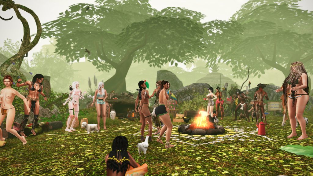 Villagers dance around a fire in the jungle camp