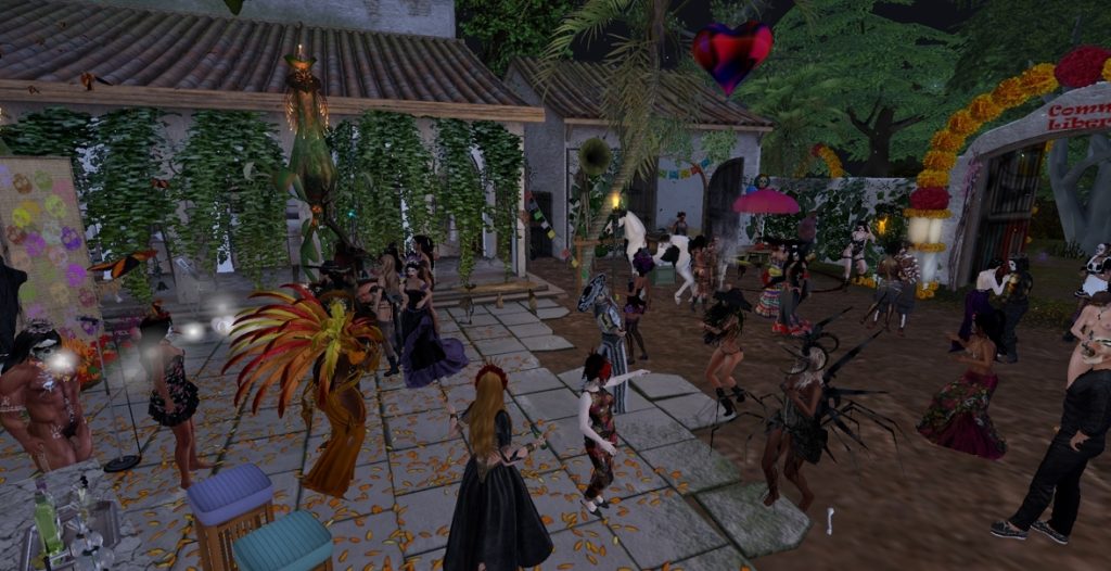 Dancers in colorful attire celebrate in a lively jungle camp gathering at dusk