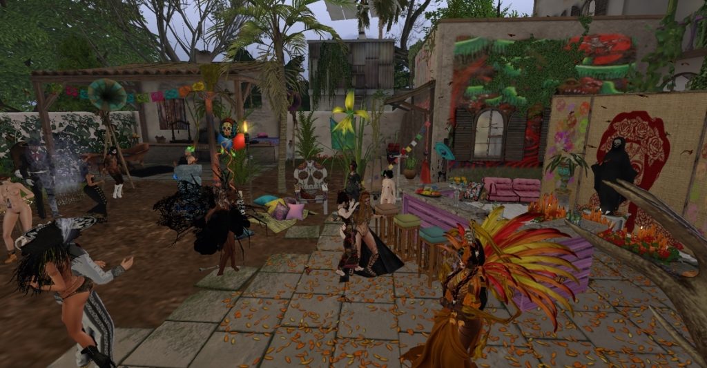 Dancers in vibrant costumes celebrate in the decorated jungle camp