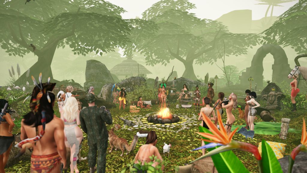 Gathering of villagers around a fire in the jungle camp with animals nearby