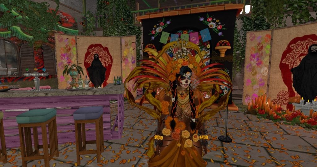 Dancer adorned with feathers and flowers stands in a decorated ritual area in the jungle camp