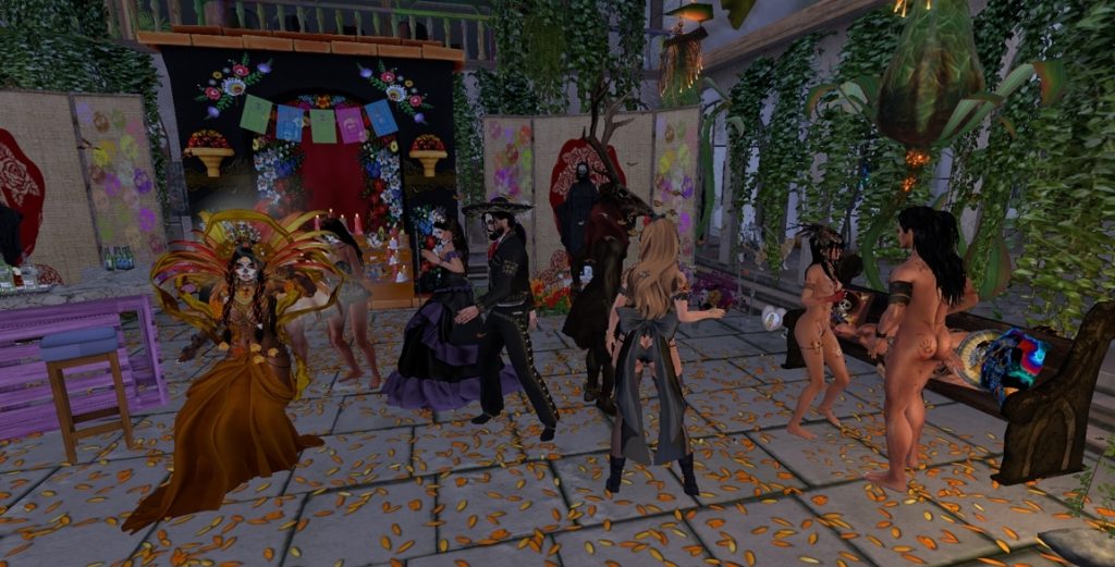 Dancers in colorful costumes celebrate in a festively decorated jungle camp