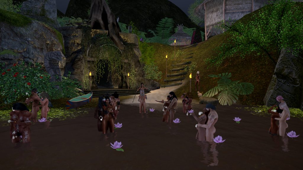 Villagers gather in the riverbank at night surrounded by lotus flowers and torches