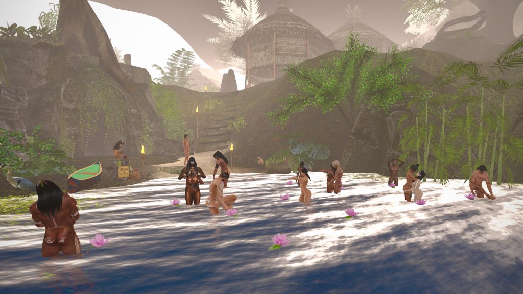 Unclothed villagers gather lotus flowers in the river near jungle huts