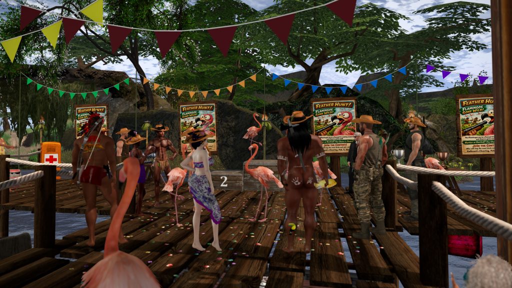 Villagers gather on a decorated river pier with flamingos and Feather Hunt posters in the jungle camp