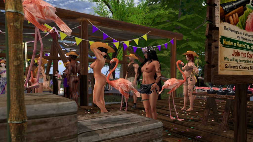 Native woman topless touches a flamingo on the wooden platform at the jungle camp