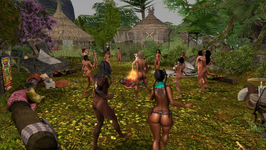 Unclothed villagers dance around a campfire in the jungle camp