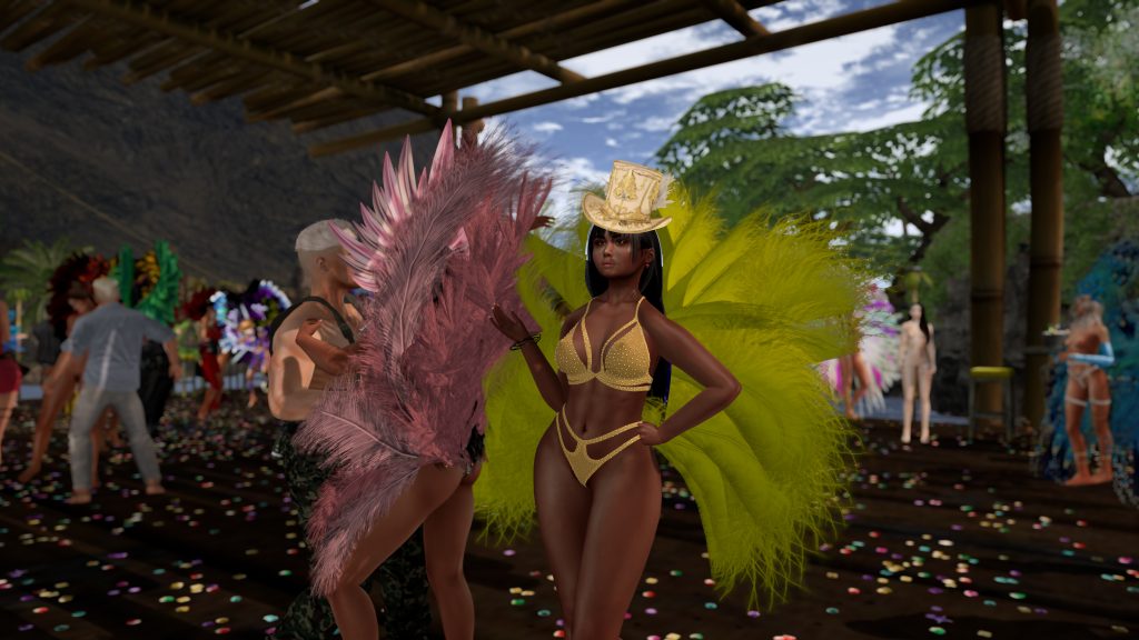 Native woman in a gold bikini poses with yellow feathered wings on the jungle camp dance floor