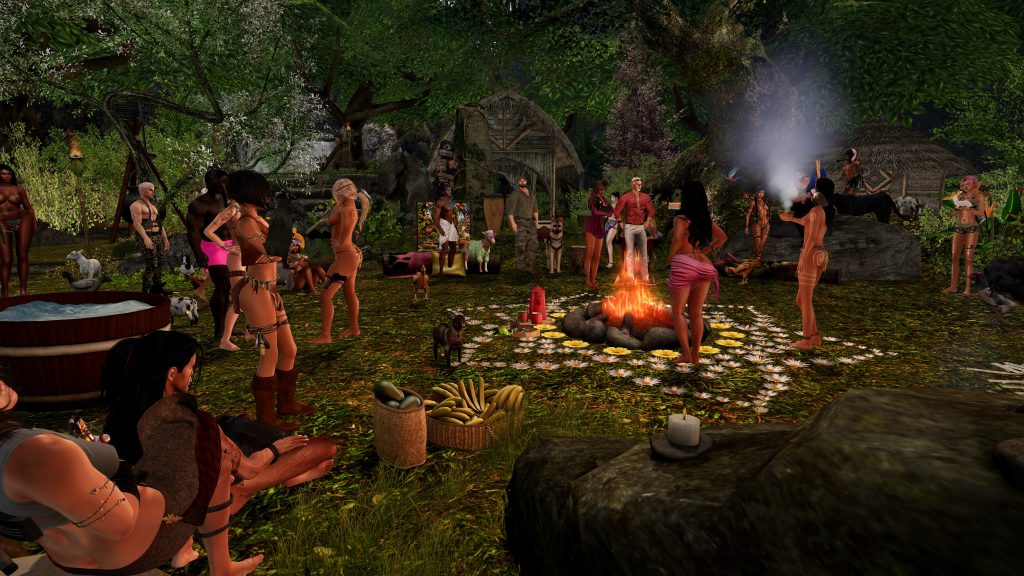 Native woman topless blows smoke from a bowl by the campfire in the jungle ritual clearing