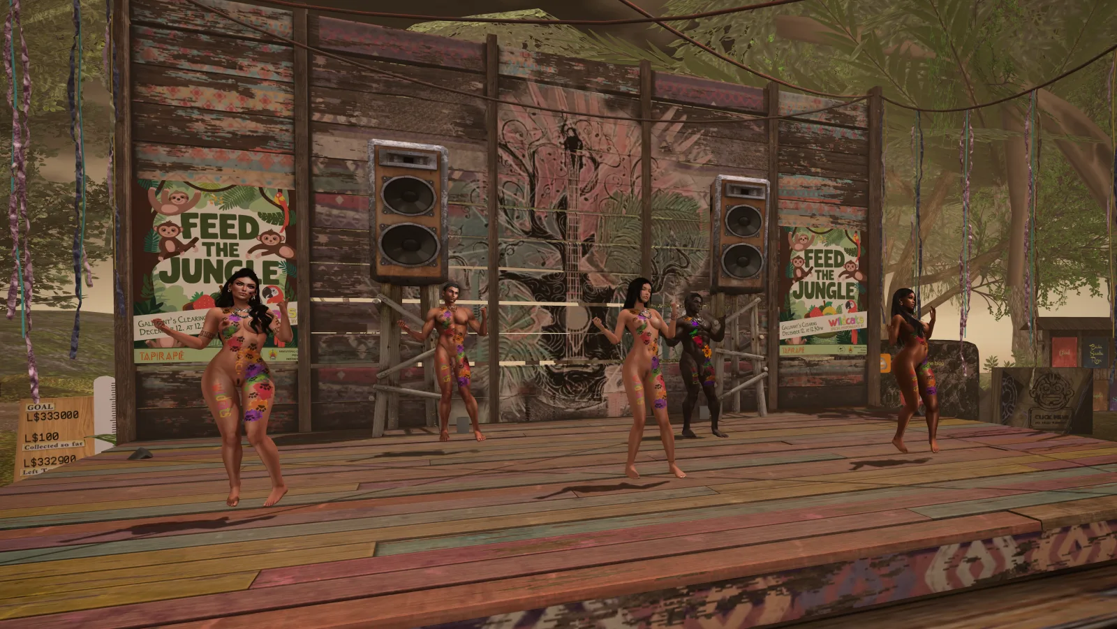 Performers in vibrant attire dance on a rustic wooden stage surrounded by jungle-themed decorations and signs.