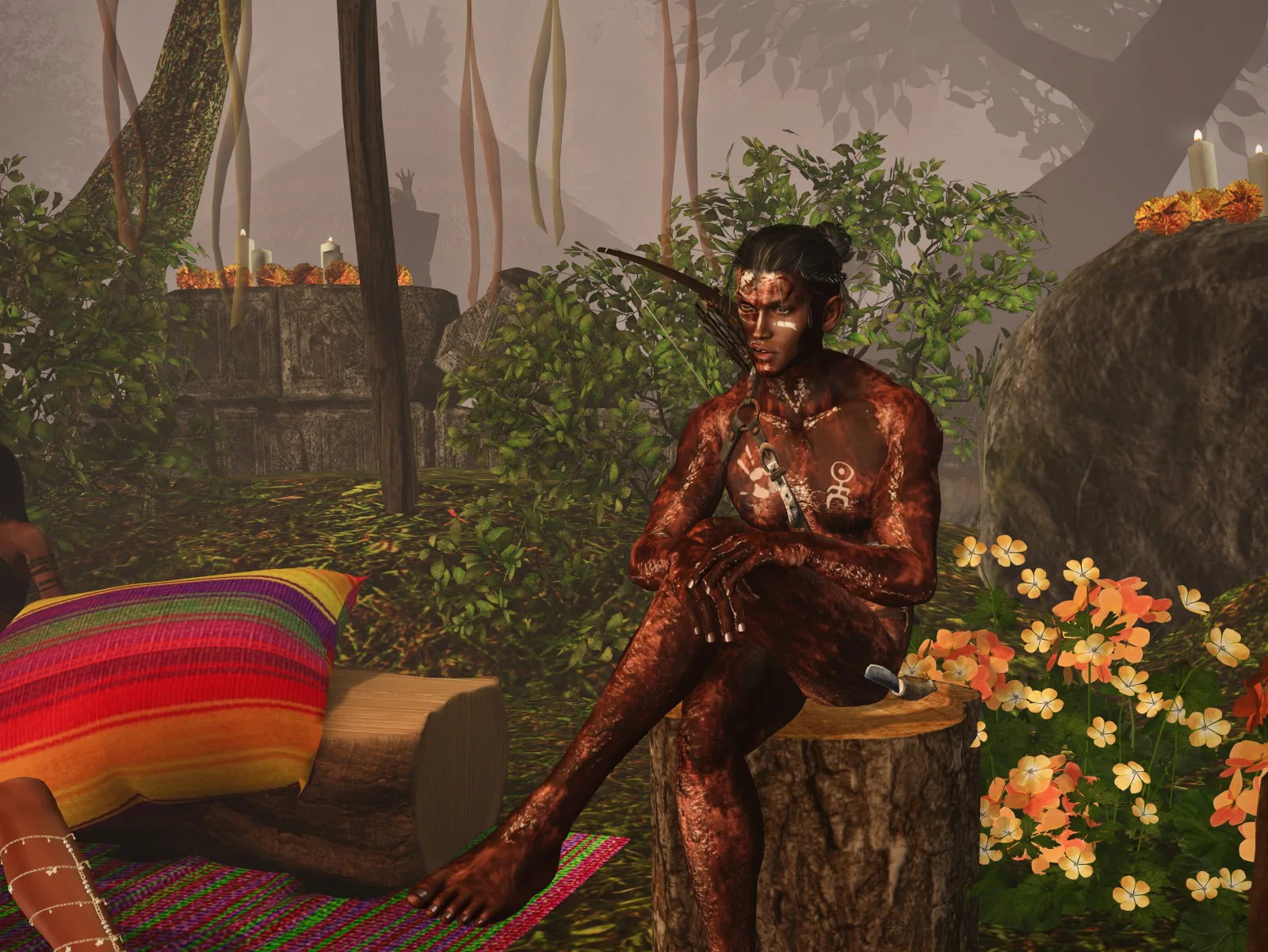 Shirtless villager sits on a log among colorful flowers and candles in the jungle camp