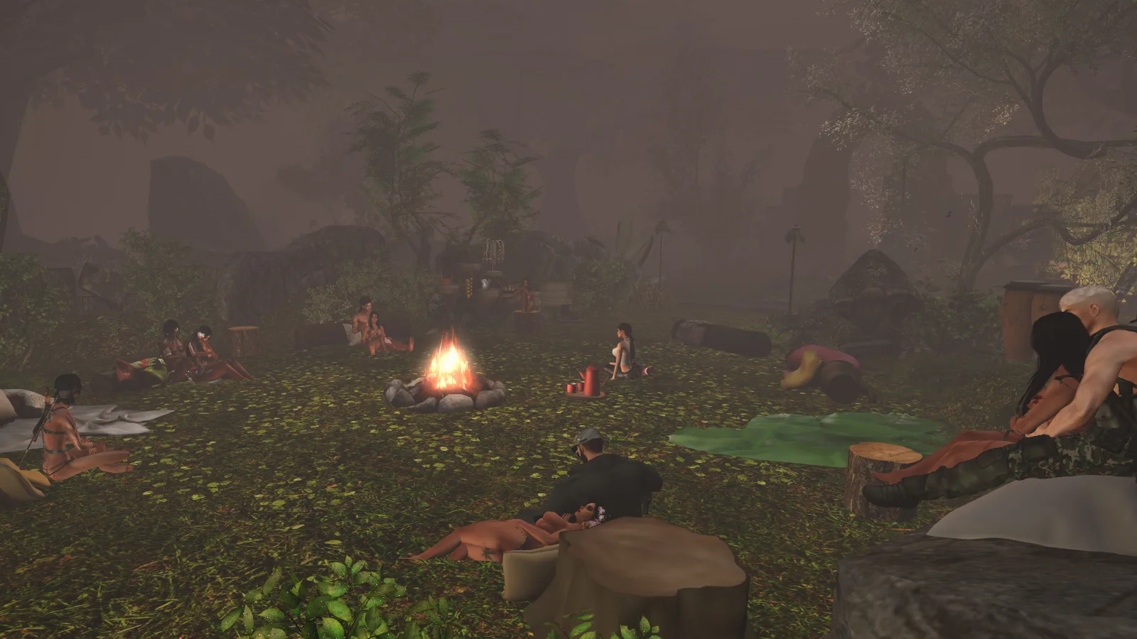Villagers gather around a campfire in the jungle clearing, relaxing and talking