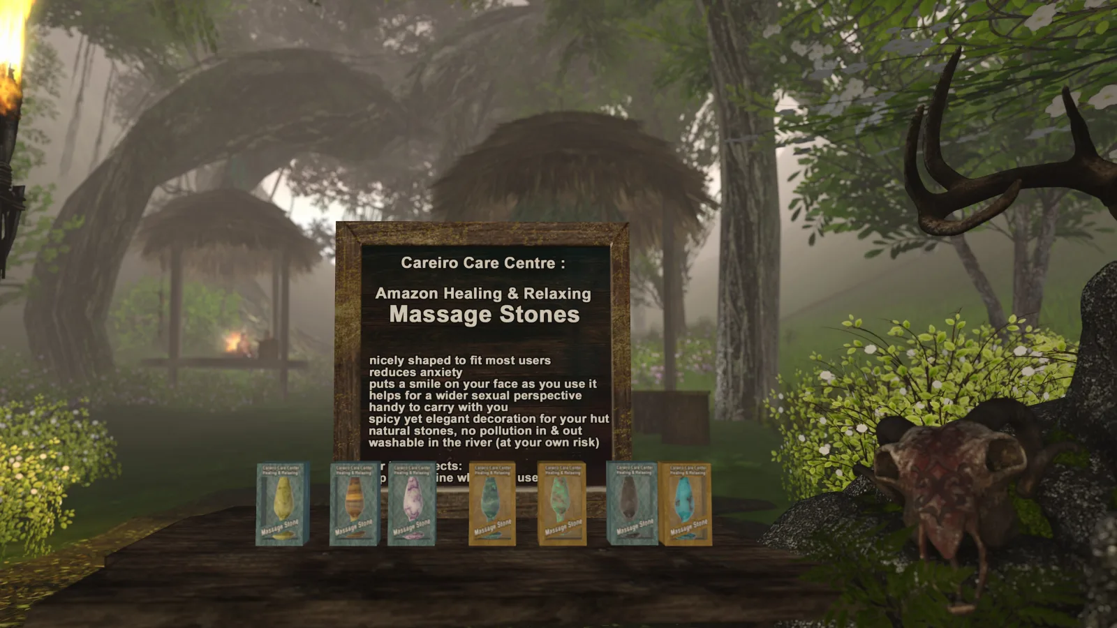 Massage stones displayed on a wooden table with a sign in a jungle camp