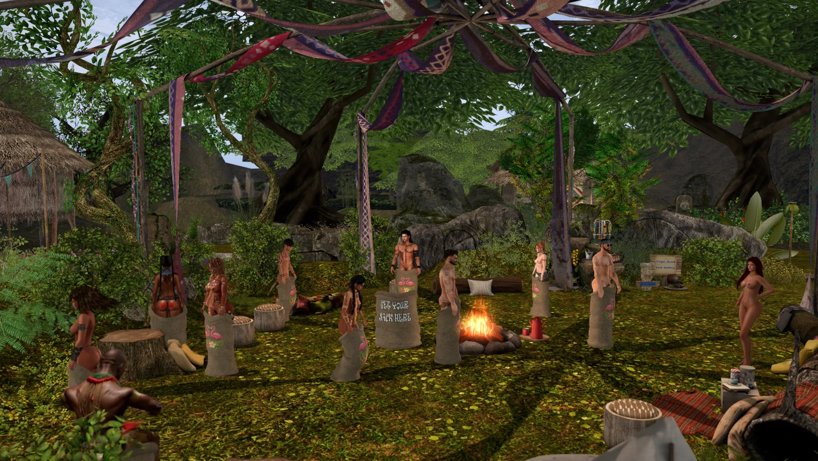 Unclothed native woman watches villagers hop in sacks around a campfire in the jungle camp
