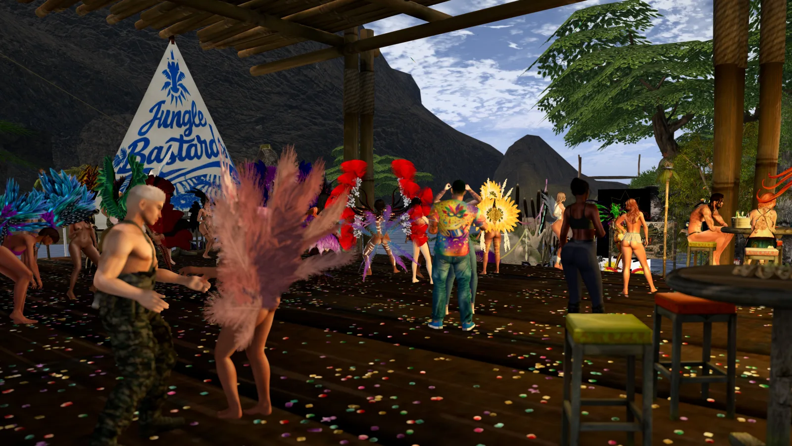 Dancers perform on a confetti-strewn jungle camp stage while villagers watch by the river
