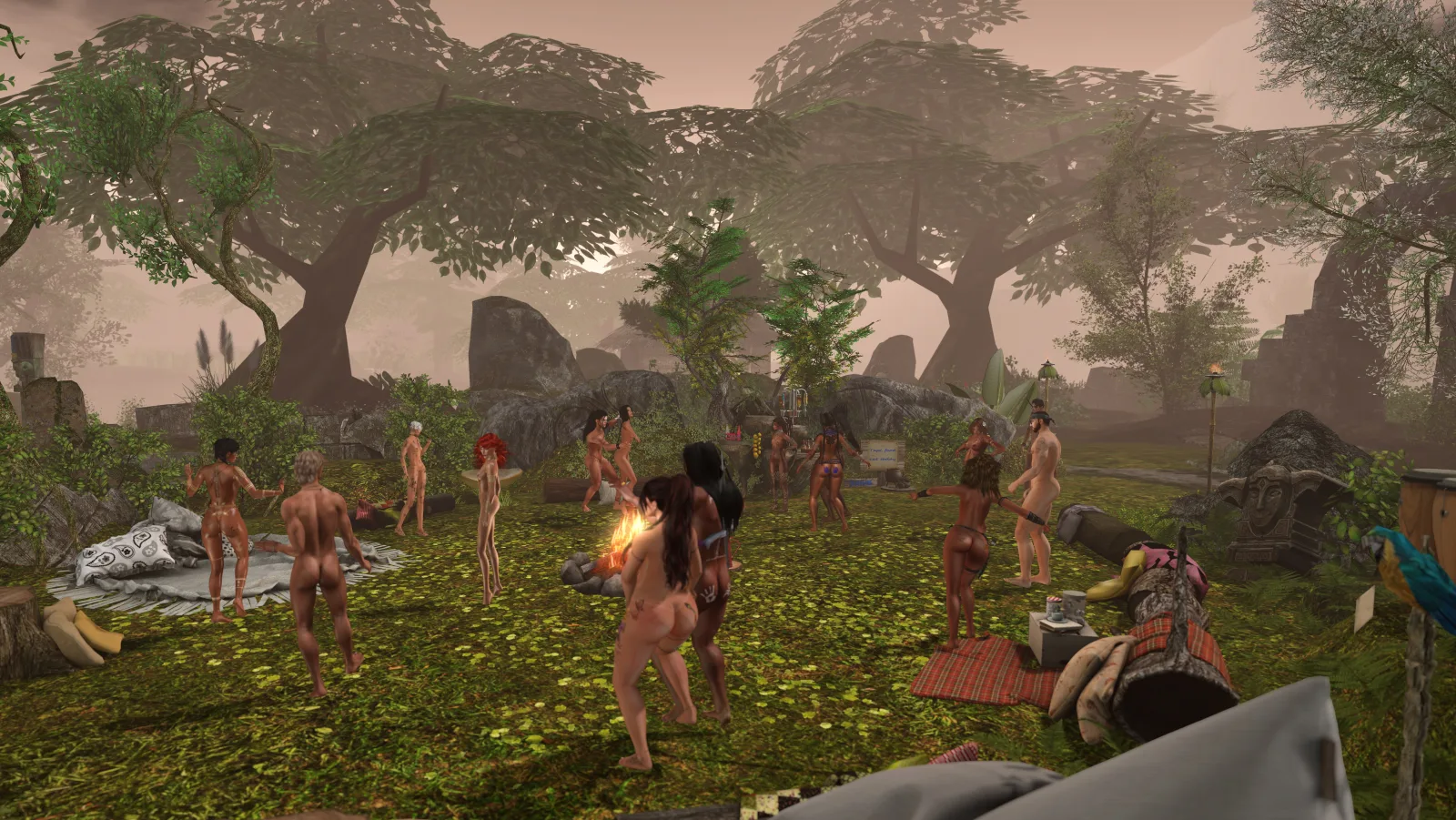 Unclothed villagers dance around a campfire in the jungle camp